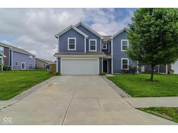 Charming two-story home featuring blue siding, a white garage door, and a well-manicured front lawn at 2485 Bristol Dr, Franklin, IN 46131
