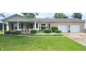 Charming ranch-style home with well-manicured lawn and stone exterior at 3039 28Th St, Columbus, IN 47203