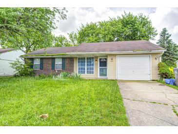 Ranch home featuring brick and siding exterior, an attached garage and a front yard at 5401 Padre Ln, Indianapolis, IN 46237