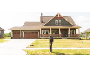 Charming craftsman-style home with a two-car garage, inviting front porch, and well-manicured lawn at 0 Goat Hollow Lot 4, Martinsville, IN 46151