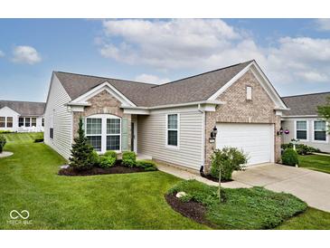 Charming single-story home with a well-manicured lawn and attached two-car garage at 15937 Marsala Dr, Fishers, IN 46037