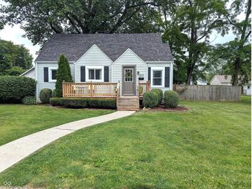 Charming home with a well-manicured lawn, inviting front porch and beautiful landscaping at 1637 Meridian St, Columbus, IN 47201