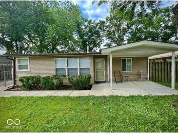 Charming home featuring a covered front porch, tidy landscaping, and a well-maintained lawn at 3161 Normandy Rd, Indianapolis, IN 46222