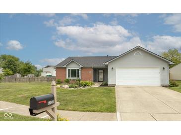 Charming single-story home with manicured lawn and attached two car garage at 18005 Gasparilla Ct, Westfield, IN 46062