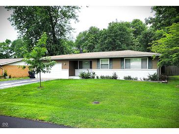 Charming single-story home with a well-maintained lawn and mature trees, offering great curb appeal at 22 Brooklyn Ct, Mooresville, IN 46158