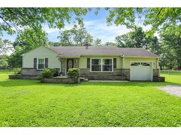 Charming single-story home with a well-manicured lawn and inviting curb appeal, perfect for suburban living at 7600 S Oak Dr, Indianapolis, IN 46227