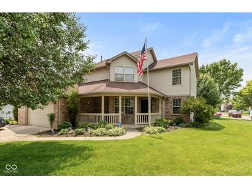 Charming home featuring a spacious front yard and a welcoming covered porch at 1159 Oak Leaf Rd, Franklin, IN 46131