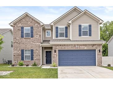 Two-story home featuring a two-car garage, brick accents, blue shutters, and a well-maintained lawn at 126 Winding Brook Way, Pendleton, IN 46064