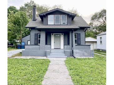 Charming gray two-story home with a well-maintained lawn and front walkway at 2720 S Taft Ave, Indianapolis, IN 46241
