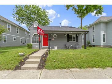 Charming gray home with a red front door and cozy front porch at 422 W Broadway St, Greenwood, IN 46142