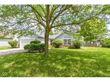 Well-maintained home with green lawn, mature trees and landscaping at 10262 Carmine Dr, Noblesville, IN 46060