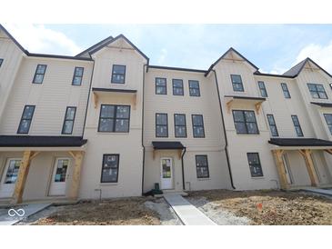 Charming townhome exterior showing brick facade and black framed windows at 4161 Barrel Ln, Westfield, IN 46062