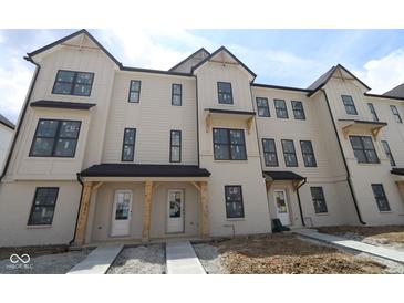 New townhome exterior featuring white paint and black trim at 4171 Barrel Ln, Westfield, IN 46062