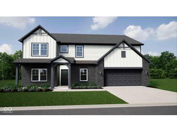 Two-story home with a brick and siding exterior and a two-car garage at 4882 Morning Valley Ct, McCordsville, IN 46055