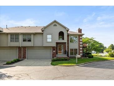 Charming townhome features a well-manicured lawn and attached two-car garage, in a cul-de-sac at 8955 Stonegate Rd # A, Indianapolis, IN 46227