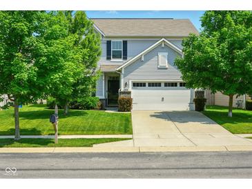 Charming two-story home with a well-maintained lawn and attached two car garage at 10606 Glenwyck Pl, Noblesville, IN 46060