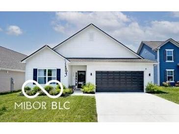 Charming single-story home with a well-manicured lawn, black garage door and neutral paint scheme at 4726 Amber Wood Ln, Indianapolis, IN 46235