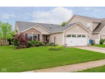Charming single-story home with brick and siding, a well-maintained lawn, and an attached two-car garage at 12535 Old Pond Rd, Noblesville, IN 46060