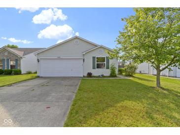 Charming single-story home featuring a well-maintained lawn and an attached two-car garage at 3423 Summer Breeze Cir, Indianapolis, IN 46239