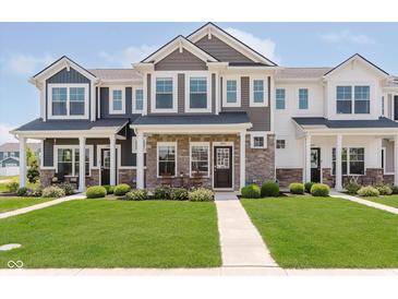 Inviting townhomes with stone accents, manicured lawns, and welcoming front porches, perfect for suburban living at 3643 Thomas Jefferson St, Westfield, IN 46074