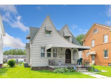 Charming two-story home featuring awnings and a covered front porch at 3018 S Anthony Blvd, Fort Wayne, IN 46806