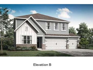 Charming two-story home with a 3-car garage, beautiful architectural details, and a well-manicured lawn at 7679 Barston Way, Avon, IN 46123