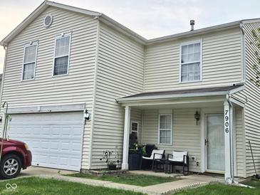 Charming home featuring a two-car garage and welcoming front porch at 7906 States Bend Ln, Indianapolis, IN 46239