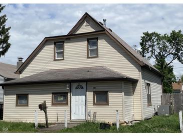 Charming two-story home with vinyl siding, a newer roof, and a 'For Sale' sign in the window at 1163 Groff Ave, Indianapolis, IN 46222