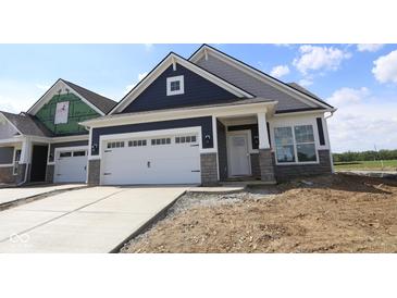 New construction home featuring a two-car garage, stone accents, and a modern, stylish design at 12532 Morning Ridge Way, Noblesville, IN 46060