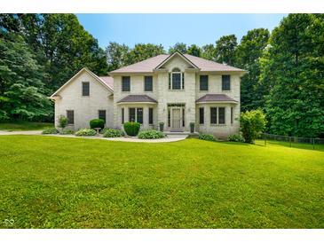Stunning two-story home with a well-manicured lawn and professional landscaping at 5055 Turkey Track Rd, Martinsville, IN 46151