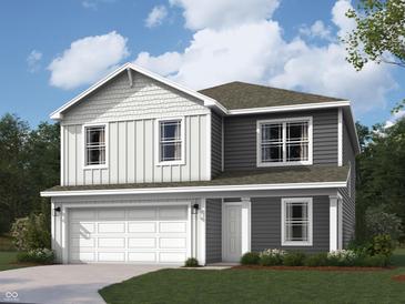 Two-story home featuring gray and white siding, a two-car garage, and a well-manicured lawn at 1207 Mcbride St, Greenfield, IN 46140