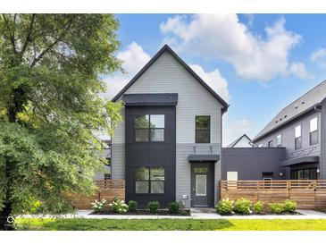 Modern two-story home with gray siding, black accents, and professionally landscaped front yard at 1834 Rosette Way, Indianapolis, IN 46202