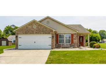 Charming single-story home with a brick facade, attached garage, and well-manicured lawn at 7 Pondview Ct, Brownsburg, IN 46112