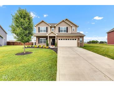 Two-story home with a brick and siding facade, complemented by a well-manicured lawn and a two-car garage at 937 Maple Stone Dr, Greenwood, IN 46143
