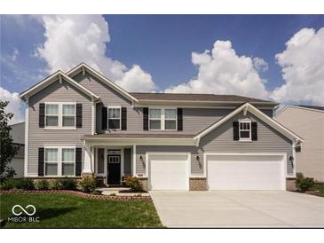 Charming two-story home features a well-maintained lawn and a two-car garage at 1312 Donald Pass, Greenwood, IN 46143