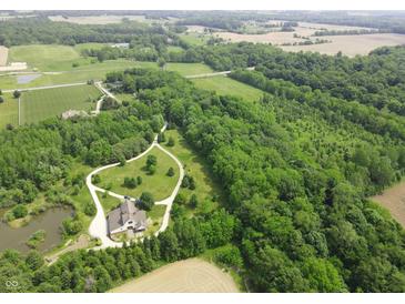 Stunning aerial view of a secluded home surrounded by lush greenery and a winding driveway at 2825 E 216Th St, Cicero, IN 46034