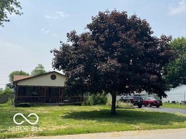 Charming home with a covered front porch and well-established landscaping at , Shelbyville, IN 46176