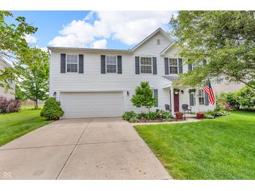 Charming two-story home featuring a well-manicured lawn and an attached two-car garage at 3637 Newberry Rd, Plainfield, IN 46168