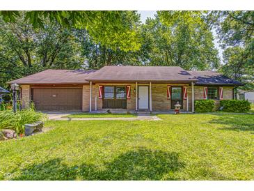 Charming single-story brick home with a well-manicured lawn and an attached garage at 436 N 500 W, Anderson, IN 46011