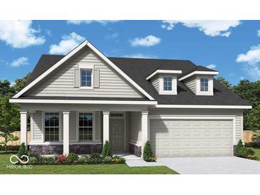 Charming single-Gathering home with a classic design, two-car garage, and inviting covered porch at 14277 Coyote Rdg, Noblesville, IN 46060