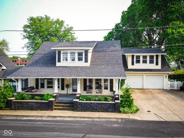 Charming two-story home with inviting front porch and meticulously landscaped yard at 251 North St, Danville, IN 46122