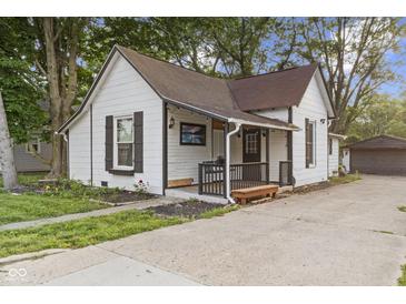 Charming two-story home with a front porch and well-maintained lawn at 330 S Green St, Brownsburg, IN 46112