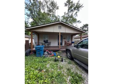 Cozy single-story home with a covered front porch and space for outdoor seating at 4607 Melrose Ave, Indianapolis, IN 46241