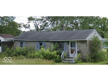Charming single-story house with brick exterior and a cozy front porch entrance at 4631 Terrace Ave, Indianapolis, IN 46203