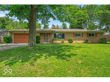 Charming single-story home with well-maintained front yard and attached garage at 108 Bennett Rd, Carmel, IN 46032