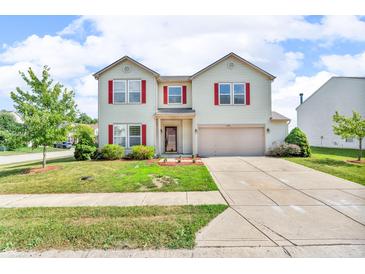 Charming two-story home featuring red shutters, a well-maintained lawn, and a classic suburban appeal at 10187 Yosemite Ln, Indianapolis, IN 46234