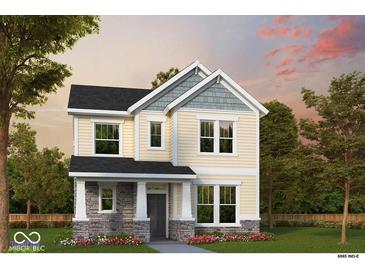 Charming two-story home featuring a stone-accented porch, neutral siding, and well-manicured landscaping at 12204 Vera Ct, Noblesville, IN 46060