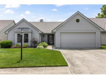 Charming single-Gathering home with a well-manicured lawn and attached two-car garage at 10753 Seaview Ln, Indianapolis, IN 46236