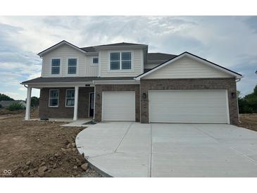 Beautiful two-story home featuring a two-car garage and a brick and siding facade at 171 Ames Dr, Whiteland, IN 46184