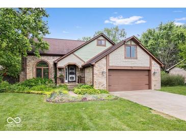 Charming two-story brick home with a well-manicured lawn and an attached two-car garage at 259 Glenbrook Ln, Avon, IN 46123